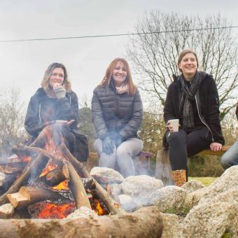 Women sat around a campfire